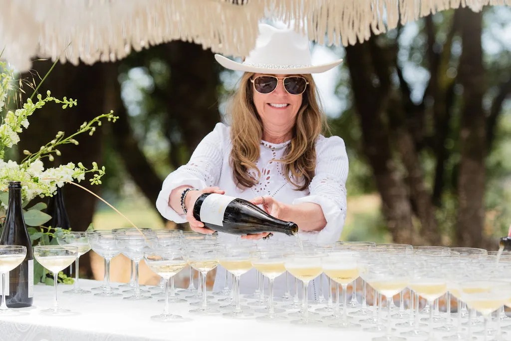 Chalk Hill White Party 2024 pouring white wine into glasses